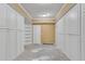 Spacious unfinished storage room with white cabinets and shelves at 3015 Foxhall Overlook, Roswell, GA 30075