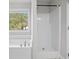 This bathroom features a walk in shower and a white tub at 3575 Bonneville Dr, Cumming, GA 30041