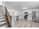 Modern kitchen features wood floors, stainless steel appliances and breakfast bar at 3575 Bonneville Dr, Cumming, GA 30041