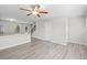 Open-concept living room showcases wood floors, kitchen view, and plenty of natural light at 3575 Bonneville Dr, Cumming, GA 30041