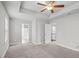 Spacious main bedroom with tray ceilings and neutral tones at 3575 Bonneville Dr, Cumming, GA 30041