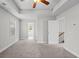 Spacious main bedroom with tray ceilings and neutral tones at 3575 Bonneville Dr, Cumming, GA 30041