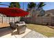 Cozy backyard with patio set, red umbrella, and privacy fence at 974 Grant Se St, Atlanta, GA 30315