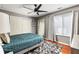 Comfortable bedroom with ceiling fan, large mirror, ample closet space, and natural light at 974 Grant Se St, Atlanta, GA 30315