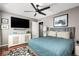 Stylish bedroom with modern ceiling fan, mounted TV, and a neutral color palette at 974 Grant Se St, Atlanta, GA 30315