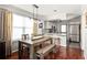 Dining area with a wooden table, natural lighting, and a view of the kitchen at 974 Grant Se St, Atlanta, GA 30315