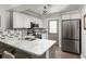 Modern kitchen with granite countertops, stainless steel appliances, and stylish backsplash at 974 Grant Se St, Atlanta, GA 30315