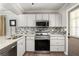 Well-equipped kitchen featuring stainless steel appliances, granite countertops, and ample cabinet space at 974 Grant Se St, Atlanta, GA 30315