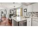 Open-concept kitchen with granite counters, stainless steel appliances, and seamless flow to dining at 974 Grant Se St, Atlanta, GA 30315