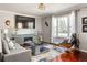 Inviting living room boasting hardwood floors, a modern fireplace, and comfortable seating at 974 Grant Se St, Atlanta, GA 30315