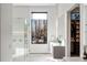 Bathroom features a glass enclosed shower, double vanity, and large window with an outside view at 1051 Wimberly Ne Rd, Brookhaven, GA 30319