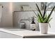 Close up shot of a modern bathroom vanity with chrome fixtures and decorative accents at 1051 Wimberly Ne Rd, Brookhaven, GA 30319