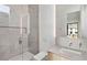 Modern bathroom featuring a glass-enclosed shower, sleek fixtures, and a minimalist design with a view of the property exterior at 1051 Wimberly Ne Rd, Brookhaven, GA 30319
