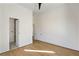 Spacious bedroom boasts hardwood floors, neutral walls, and doorway leading to a modern bathroom at 1051 Wimberly Ne Rd, Brookhaven, GA 30319