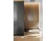 Hallway design with custom wood slats, modern lighting, and built-in bench at 1051 Wimberly Ne Rd, Brookhaven, GA 30319
