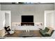 Bright living room with a fireplace, modern decor, and high ceilings at 1051 Wimberly Ne Rd, Brookhaven, GA 30319