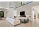 Open-concept living room with a fireplace, hardwood floors, and modern decor at 1051 Wimberly Ne Rd, Brookhaven, GA 30319