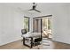 Modern office with hardwood floors, natural light, accent fan, and an executive desk at 1051 Wimberly Ne Rd, Brookhaven, GA 30319