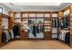 Spacious walk-in closet with custom wood shelving and ample storage for clothing and accessories at 1051 Wimberly Ne Rd, Brookhaven, GA 30319