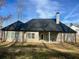 Backyard featuring a well-maintained lawn and a covered patio at 224 Crest Creek Way, Villa Rica, GA 30180
