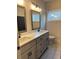 Well-lit bathroom with double vanity and granite countertops at 224 Crest Creek Way, Villa Rica, GA 30180