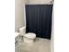 Full bathroom featuring a toilet and a shower with a black curtain at 224 Crest Creek Way, Villa Rica, GA 30180