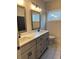 Bathroom with double vanity, large mirrors, and modern fixtures at 224 Crest Creek Way, Villa Rica, GA 30180