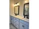 Double vanity features undermount sinks, modern fixtures, gray cabinets, and quartz counters at 224 Crest Creek Way, Villa Rica, GA 30180