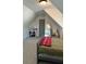 Bedroom with a desk, chair, full-length mirror, and dormer ceilings at 224 Crest Creek Way, Villa Rica, GA 30180