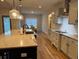 Well-lit kitchen with granite countertops, stainless appliances, and hardwood floors at 224 Crest Creek Way, Villa Rica, GA 30180