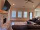 Inviting living room features a brick fireplace, a ceiling fan and plush sofa at 224 Crest Creek Way, Villa Rica, GA 30180