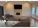 Bright living room with fireplace, vaulted ceiling, and ample natural light, perfect for relaxing and entertaining at 224 Crest Creek Way, Villa Rica, GA 30180