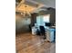 Bright office space featuring wood floors, modern chandelier, and two workstations at 224 Crest Creek Way, Villa Rica, GA 30180