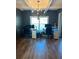 Bright office space featuring wood floors, modern chandelier, and two workstations at 224 Crest Creek Way, Villa Rica, GA 30180