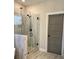 Modern shower with glass enclosure, tiled surround, and matte black fixtures at 224 Crest Creek Way, Villa Rica, GA 30180
