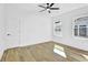 Simple bedroom with a view to the exterior, featuring modern light fixtures and wood floors at 1016 Michigan Nw Ave, Atlanta, GA 30314