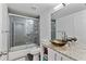 A sleek bathroom design features a modern glass bowl sink and tiled shower with glass doors at 109 Chester Se Ave, Atlanta, GA 30316