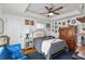 Cozy bedroom featuring hardwood floors, a comfortable bed, and ample storage space at 109 Chester Se Ave, Atlanta, GA 30316