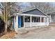 Side view of a bungalow with a quaint front porch and colorful doors at 109 Chester Se Ave, Atlanta, GA 30316