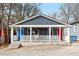 Charming bungalow with a cozy front porch and colorful doors at 109 Chester Se Ave, Atlanta, GA 30316