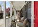 Inviting front porch with wicker seating and a hanging hammock, creating a relaxing outdoor space at 109 Chester Se Ave, Atlanta, GA 30316