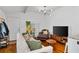 Bright living room featuring a comfortable sofa, large TV, and stylish décor, ideal for relaxation at 109 Chester Se Ave, Atlanta, GA 30316