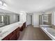Large primary bathroom with double sinks, a jetted tub, and a separate shower at 1182 Tupelo Chase Ct, Auburn, GA 30011
