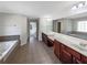 Large primary bathroom with double sinks, a jetted tub, and a separate shower at 1182 Tupelo Chase Ct, Auburn, GA 30011