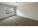 Bright and airy bedroom with neutral carpet and a large window at 1182 Tupelo Chase Ct, Auburn, GA 30011
