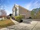 Well-maintained home with a two-car garage and a landscaped front yard at 1182 Tupelo Chase Ct, Auburn, GA 30011