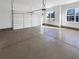 Spacious two-car garage featuring an automatic door and natural light at 1182 Tupelo Chase Ct, Auburn, GA 30011