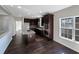 Modern kitchen with dark cabinetry, granite countertops, and stainless steel appliances at 1182 Tupelo Chase Ct, Auburn, GA 30011