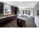 Bright kitchen with a center island and stainless steel appliances at 1182 Tupelo Chase Ct, Auburn, GA 30011