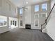 Spacious living room showcases high ceilings, a fireplace, and abundant natural light at 1182 Tupelo Chase Ct, Auburn, GA 30011